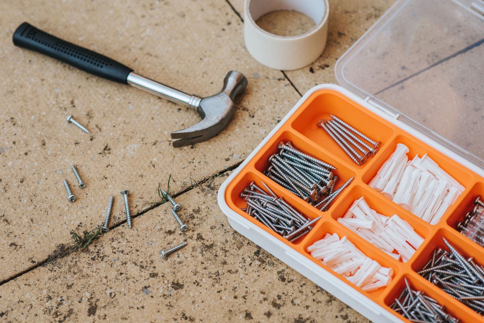 Orange organiser filled with screws and fixings