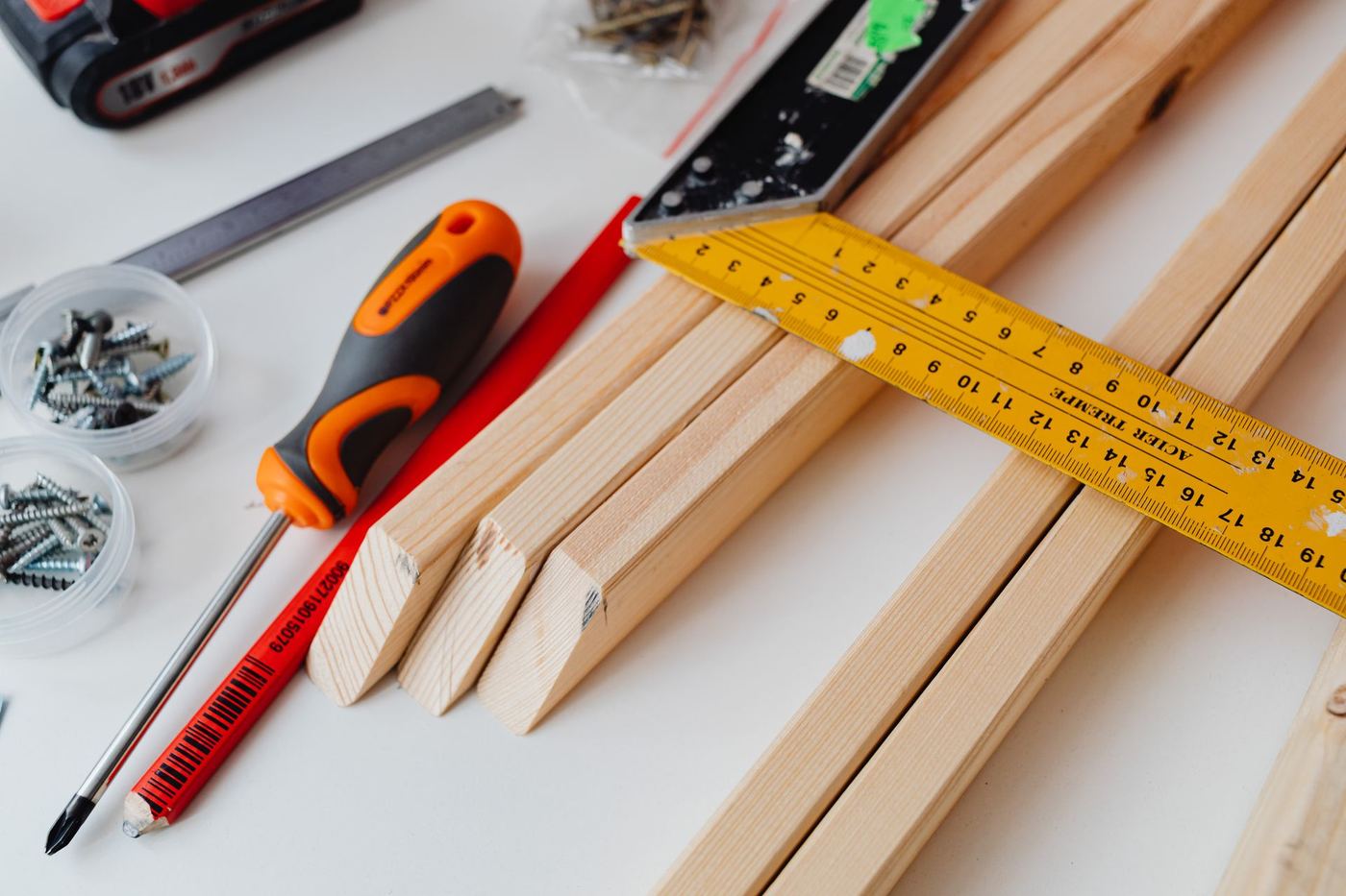 Orange-accented tools and timber for home maintenance